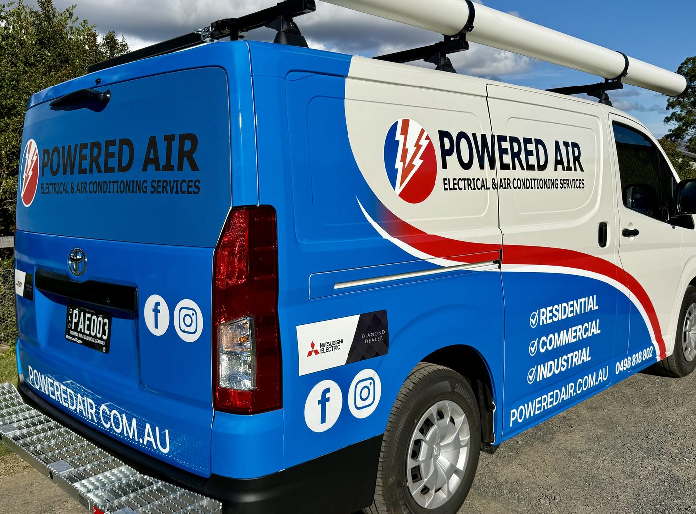 Blue and white vehicle wrap fitted to a Powered Air van
