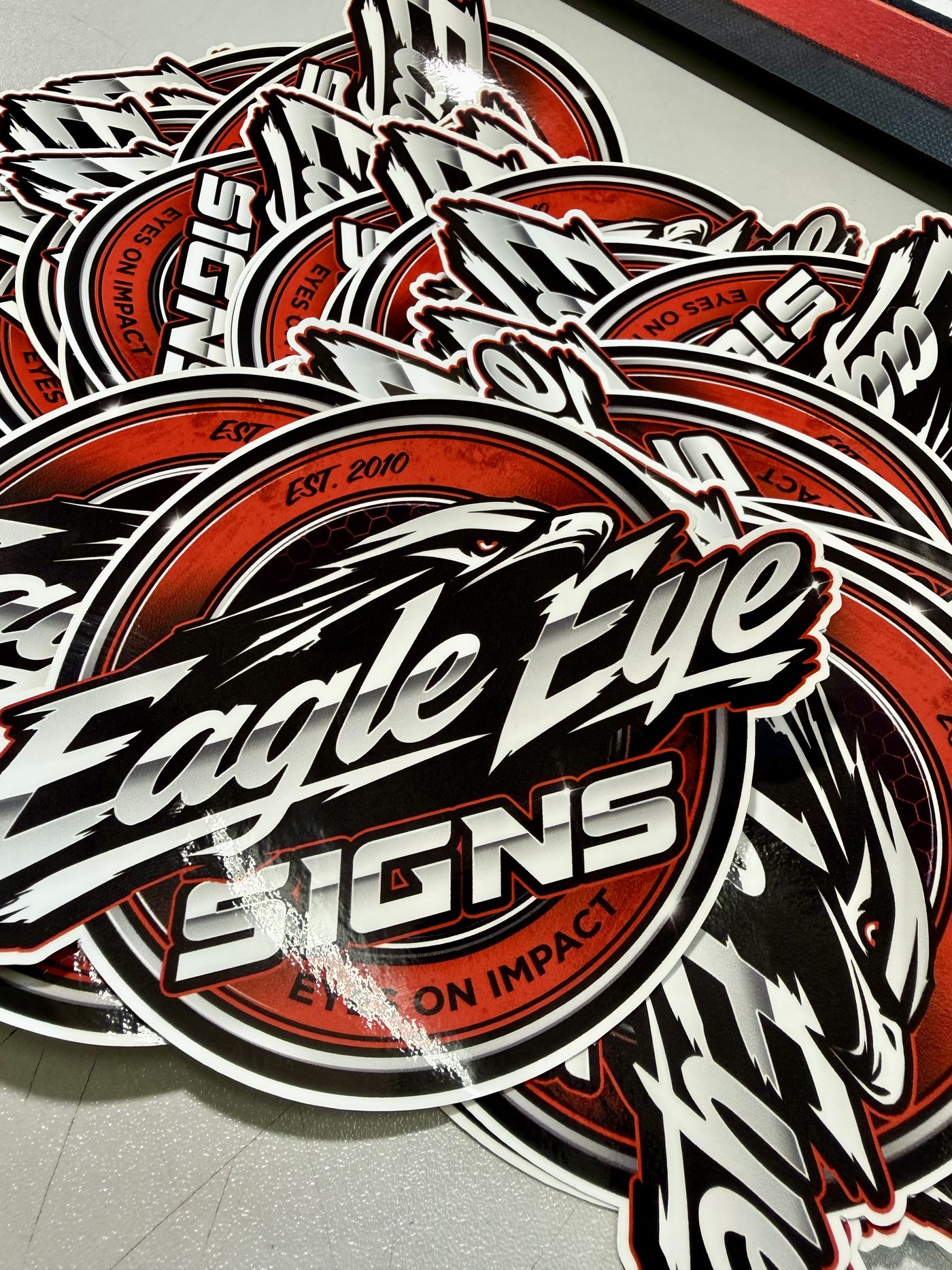 Die-cut Eagle Eye Signs stickers fresh off the cutter
